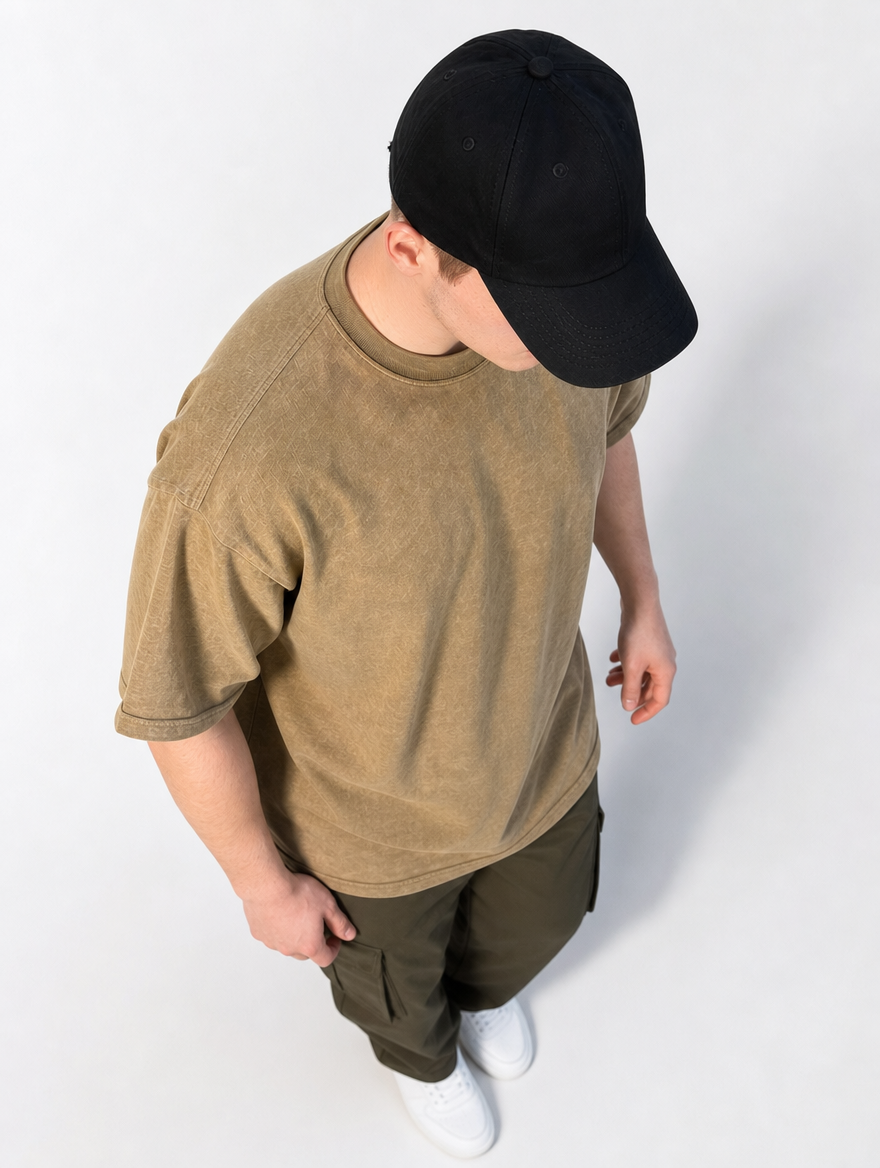Man walking in a washed tan-brown 230GSM oversized no-logo tee with cargo pants